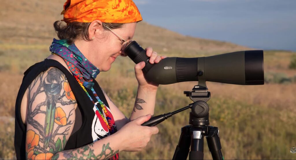 girl looking through binoculars